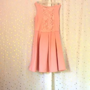 A cute light pink dress, which is size 8.